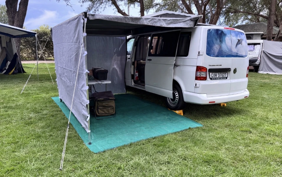 VanTom. Unique design where the pop-top is in the middle
Of the van where you can stand up in the kitchen area. photo 2