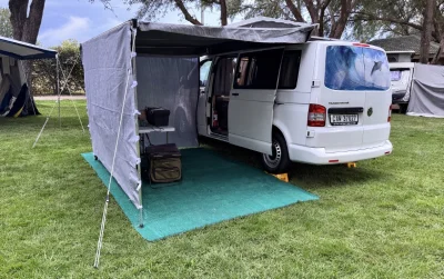 VanTom. Unique design where the pop-top is in the middle
Of the van where you can stand up in the kitchen area.