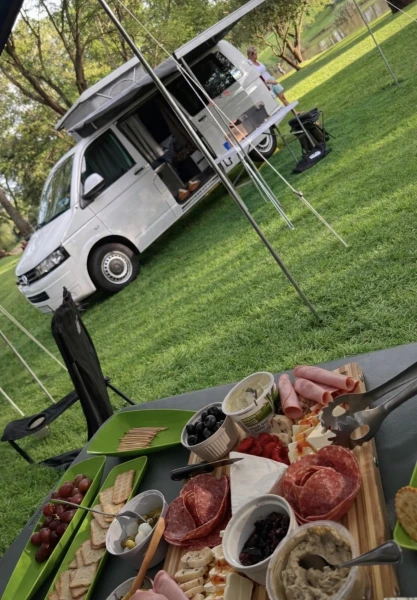 VanTom. Unique design where the pop-top is in the middle
Of the van where you can stand up in the kitchen area. photo 3
