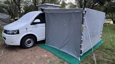 VanTom. Unique design where the pop-top is in the middle
Of the van where you can stand up in the kitchen area.