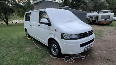 VanTom. Unique design where the pop-top is in the middle
Of the van where you can stand up in the kitchen area.