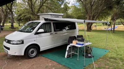 VanTom. Unique design where the pop-top is in the middle
Of the van where you can stand up in the kitchen area.